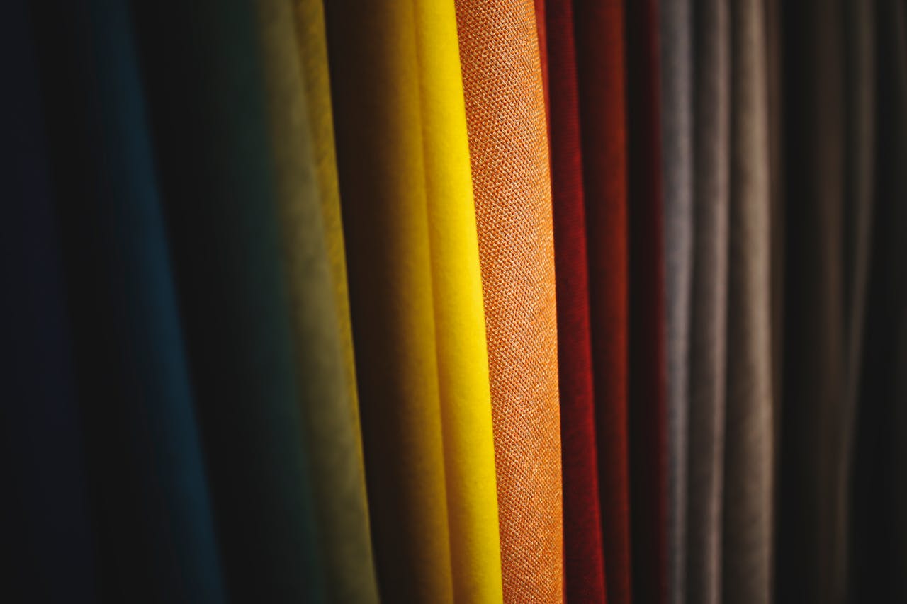 A close-up view of colorful fabric showcasing diverse textures and vibrant folds.